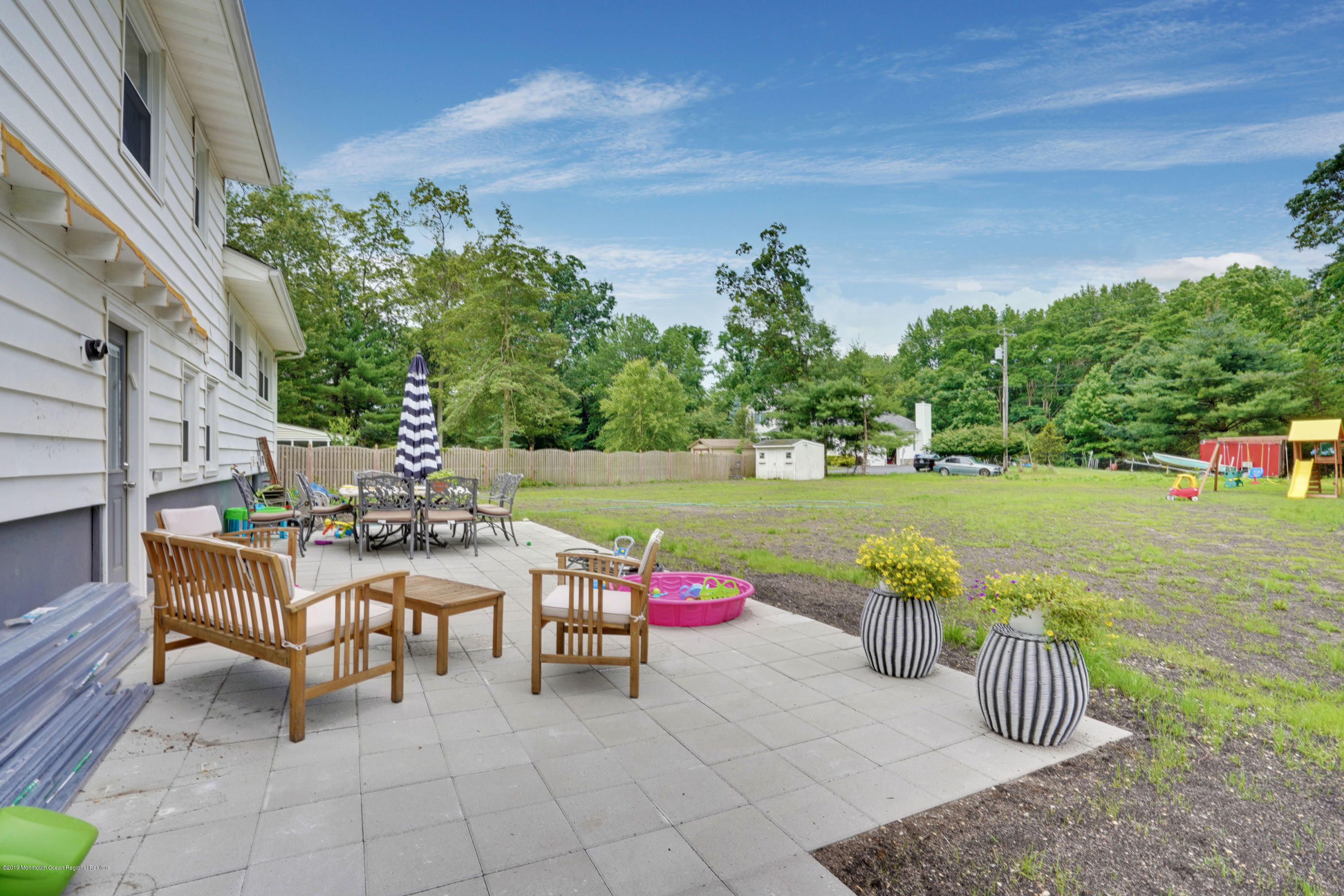 5 Ash Street Eatontown, NJ 07724 - Photo 31 of 31 a view of a chairs and table in backyard