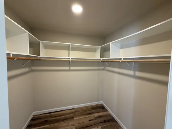 a view of an empty walk in closet