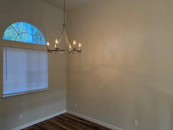 a room with a fan and a window