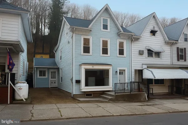 a front view of a house with a garage