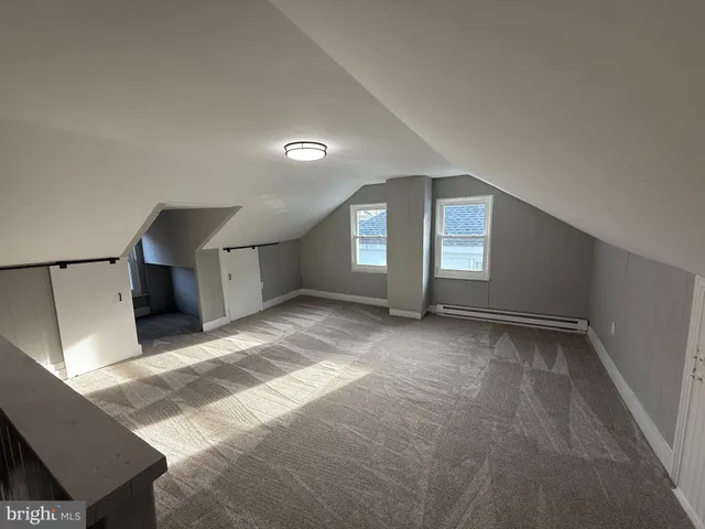 a balcony with table and chairs