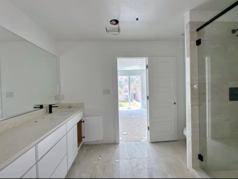 9475 Timberleaf Drive Dallas, TX 75243 - Photo 11 of 23 Bathroom with vanity and a stall shower