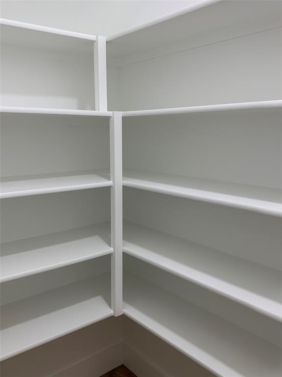 9475 Timberleaf Drive Dallas, TX 75243 - Photo 15 of 38 a view of walk in closet with empty racks