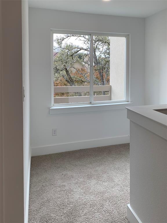 9475 Timberleaf Drive Dallas, TX 75243 - Photo 20 of 38 a view of a small space with wooden floor and a window