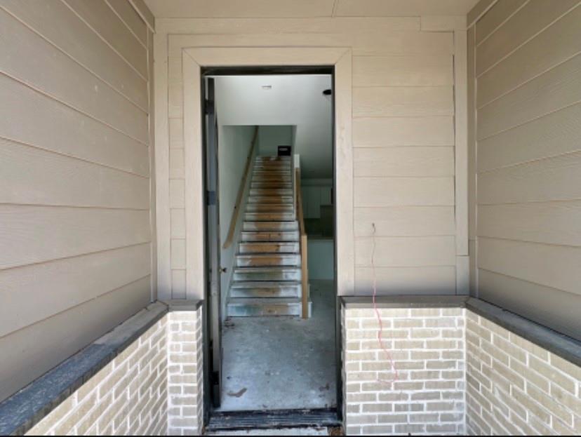 9475 Timberleaf Drive Dallas, TX 75243 - Photo 2 of 23 Doorway to property featuring brick siding