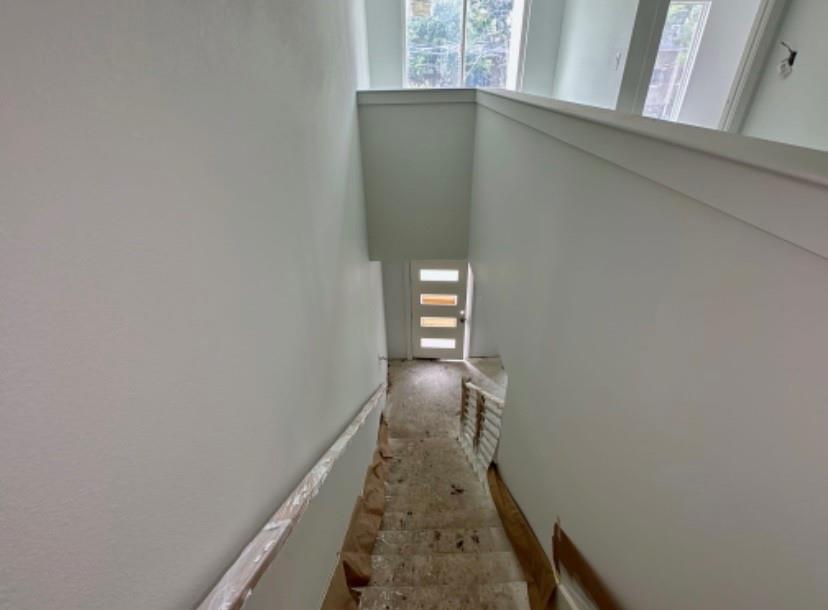 9475 Timberleaf Drive Dallas, TX 75243 - Photo 23 of 23 Staircase with a high ceiling and carpet flooring