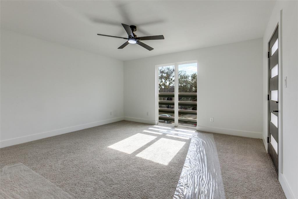 9475 Timberleaf Drive Dallas, TX 75243 - Photo 23 of 38 a view of an empty room with a window