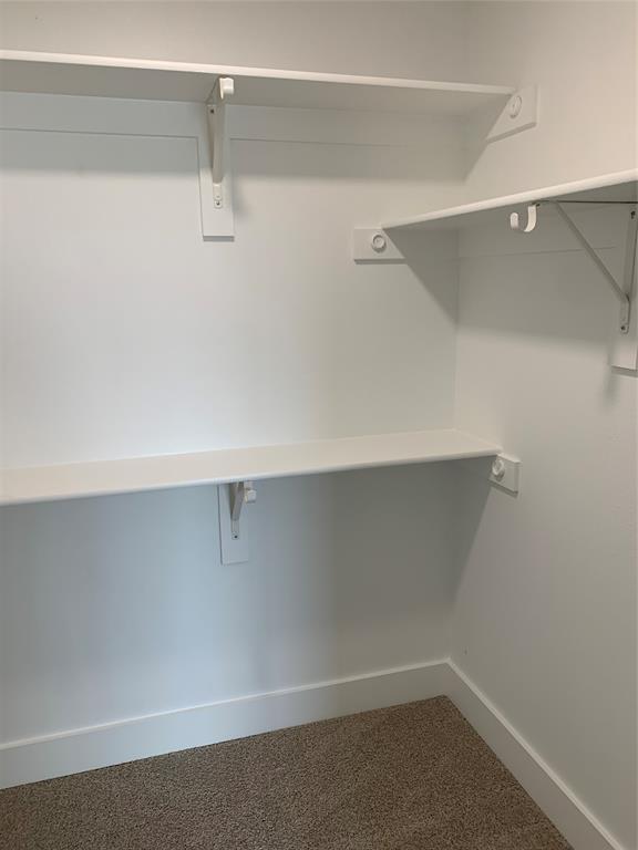 9475 Timberleaf Drive Dallas, TX 75243 - Photo 35 of 38 a view of an empty walk in closet