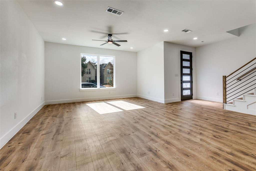 9475 Timberleaf Drive Dallas, TX 75243 - Photo 4 of 38 a view of empty room with wooden floor and fan