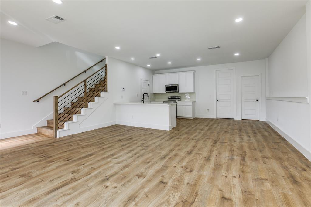 9475 Timberleaf Drive Dallas, TX 75243 - Photo 9 of 38 a view of a kitchen with a sink and a refrigerator