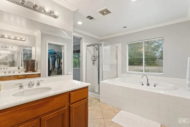a bathroom with a sink tub shower and a mirror