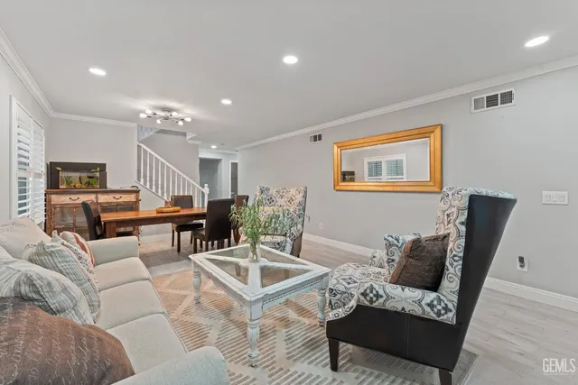 a living room with furniture and a table