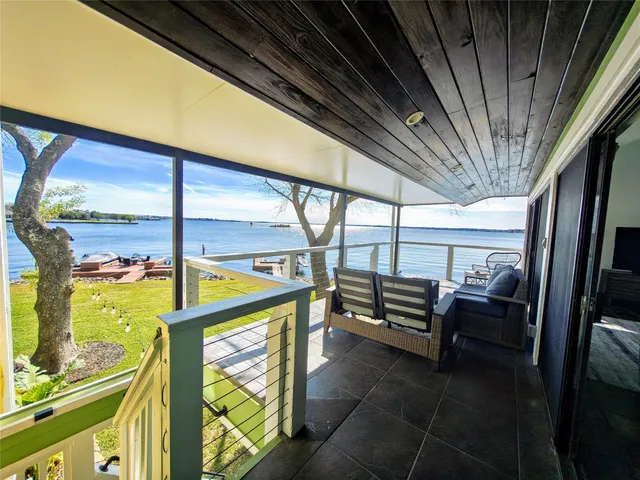 a bedroom with a bed and a refrigerator