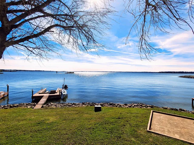 a view of a balcony with wooden floor and outdoor space