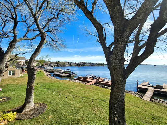 a bedroom with two beds and a large window