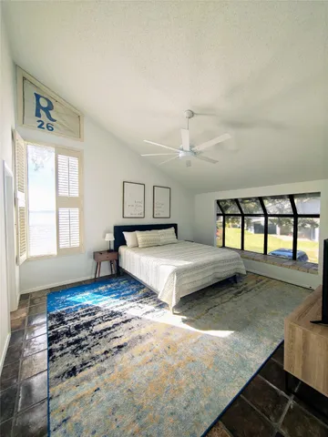 a bedroom with a bed and a cabinets