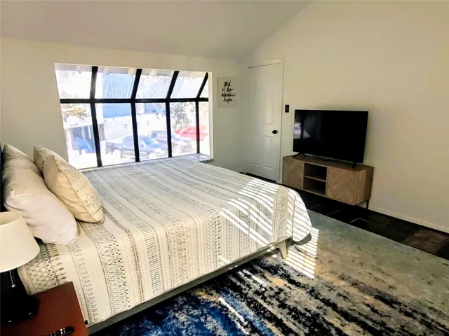 a bathroom with a double vanity sink a mirror and a shower