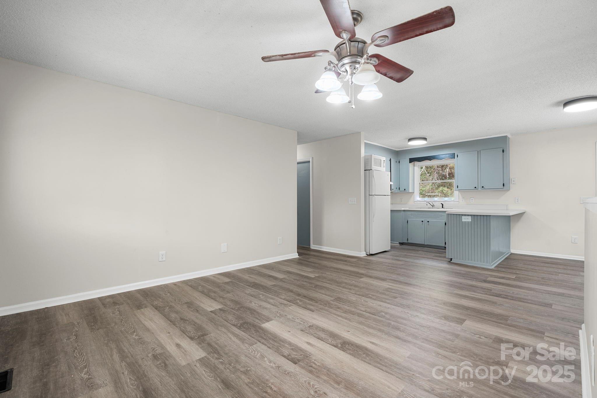 4815 Mt Olive Church Road Morganton, NC 28655 - Photo 14 of 27 a view of an empty room with a chandelier fan
