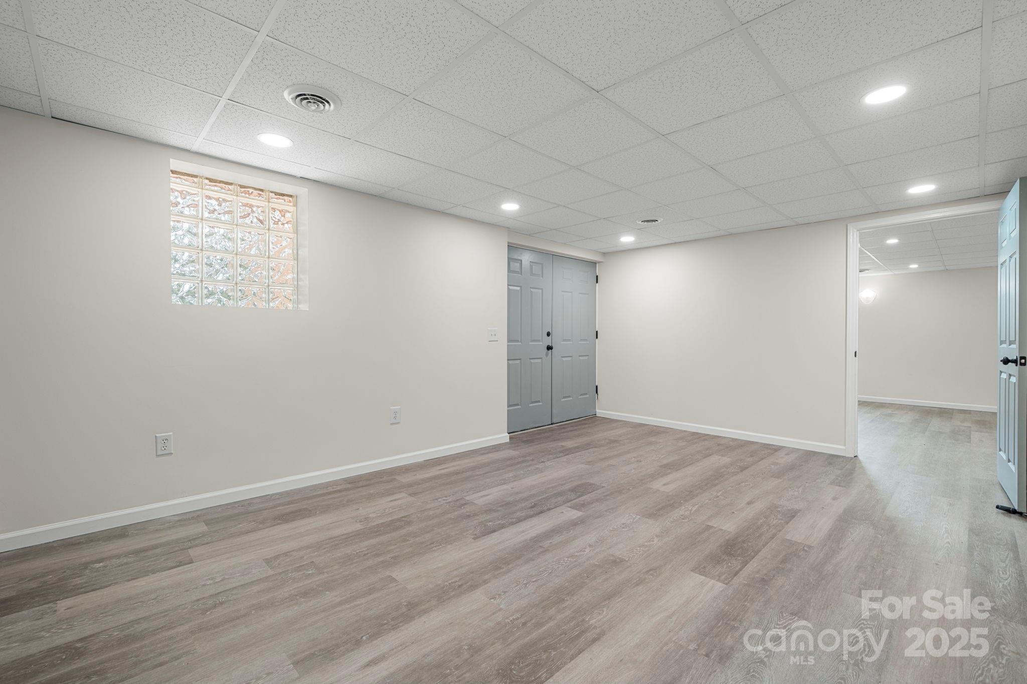 4815 Mt Olive Church Road Morganton, NC 28655 - Photo 25 of 27 an empty room with wooden floor and windows