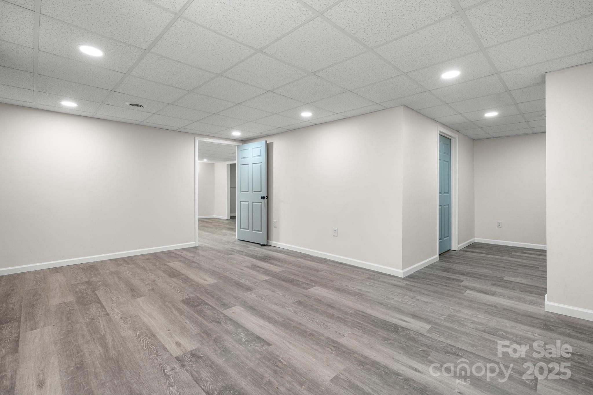 4815 Mt Olive Church Road Morganton, NC 28655 - Photo 26 of 27 an empty room with wooden floor and windows