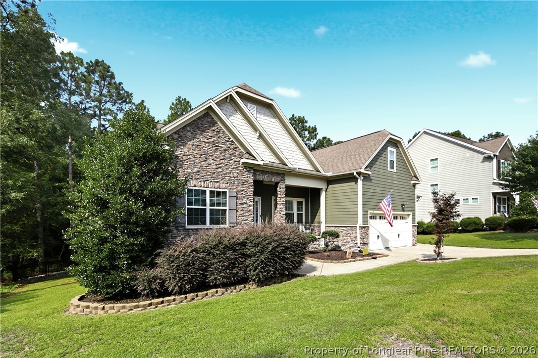 148 Heatherspring Way Spring Lake, NC 28390 - Photo 3 of 50 a front view of house with yard and green space