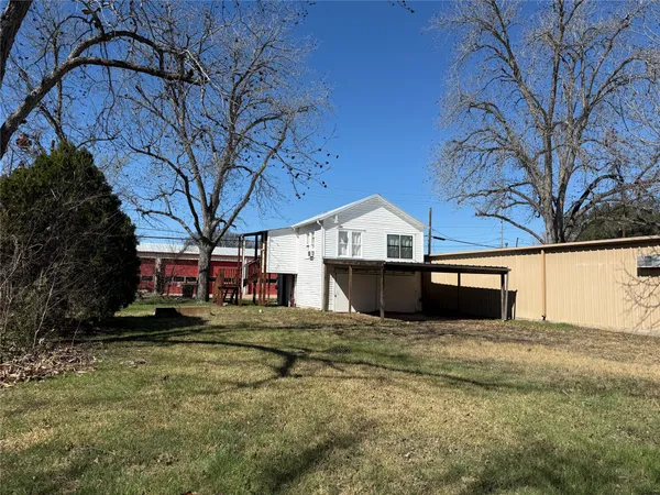a view of yard with large tree