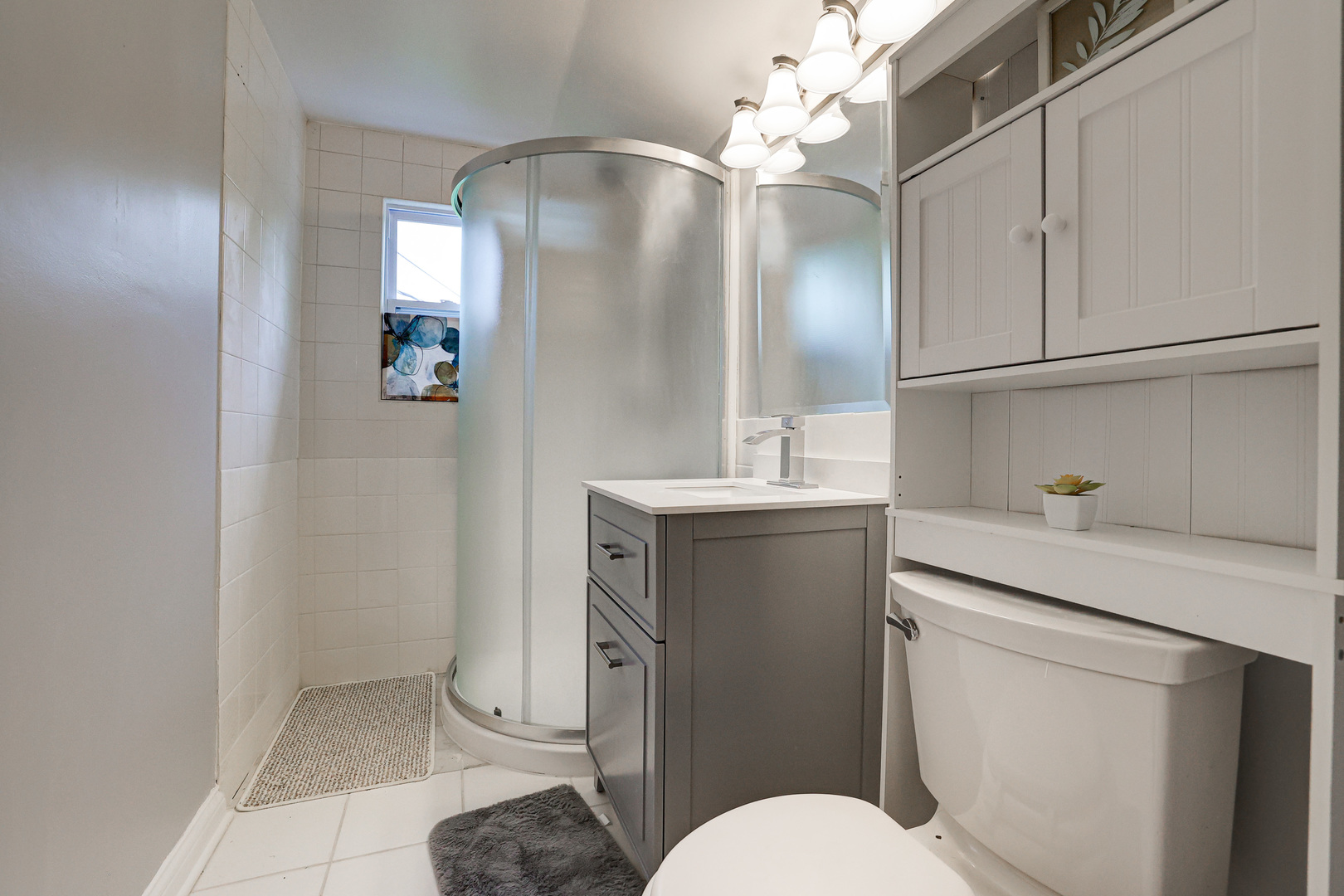 1401 Sunset Ridge Road Northbrook, IL 60062 - Photo 12 of 27 a bathroom with a sink a toilet and mirror