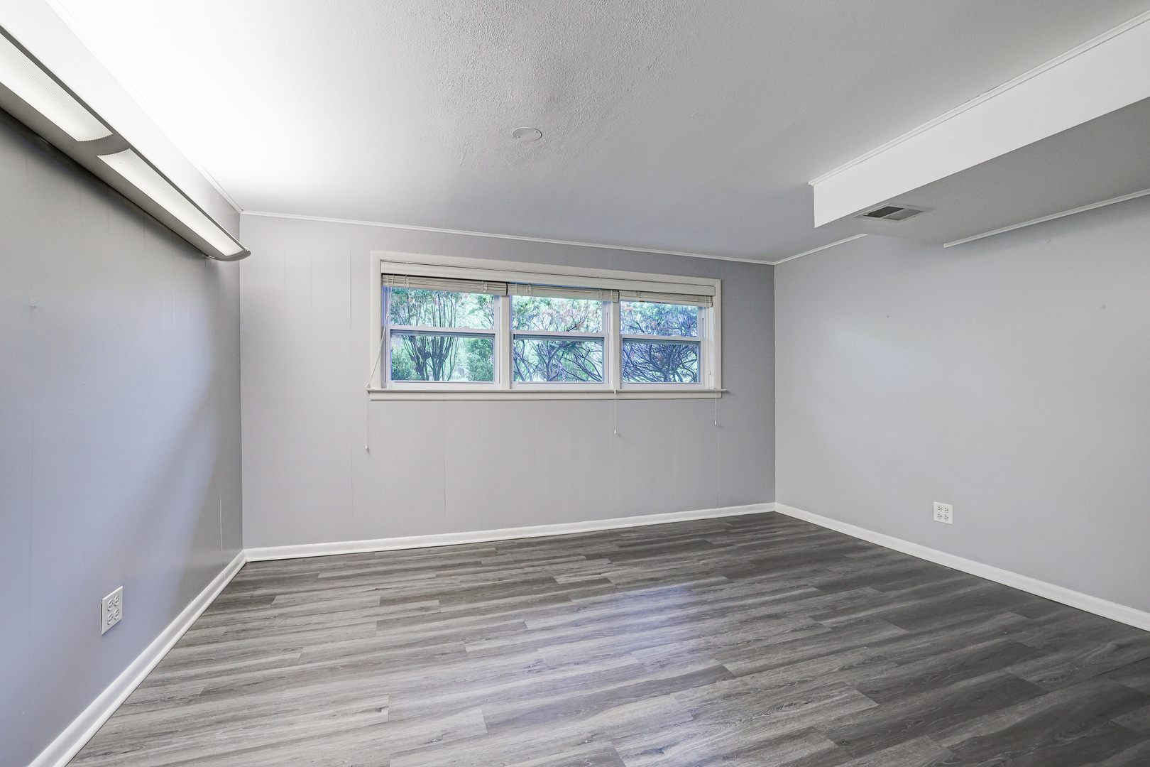 1401 Sunset Ridge Road Northbrook, IL 60062 - Photo 17 of 27 wooden floor in an empty room with a window