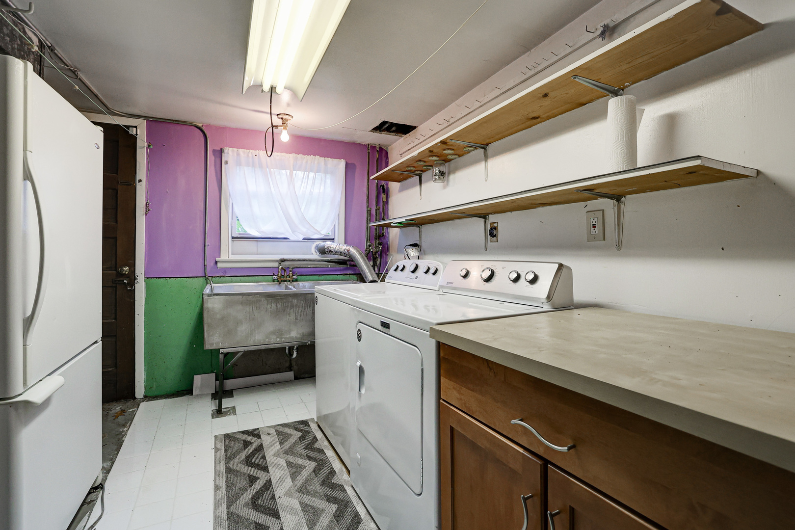 1401 Sunset Ridge Road Northbrook, IL 60062 - Photo 19 of 27 a utility room with a sink a washer and dryer