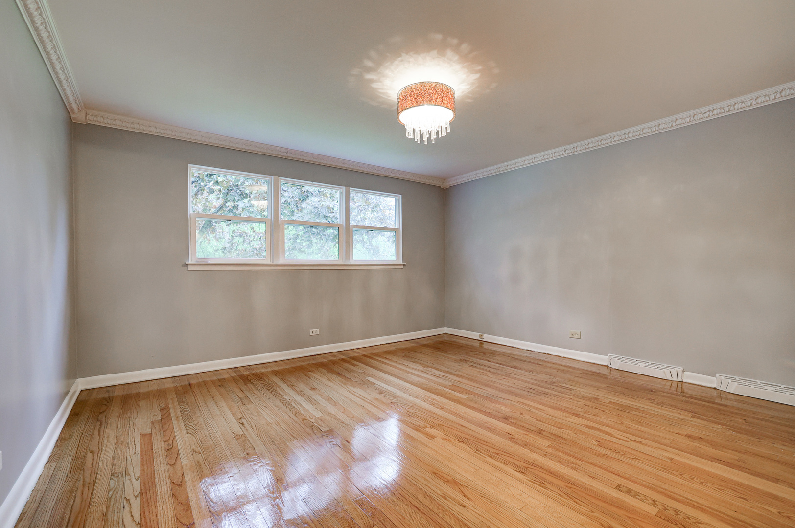 1401 Sunset Ridge Road Northbrook, IL 60062 - Photo 8 of 27 wooden floor in an empty room with a window