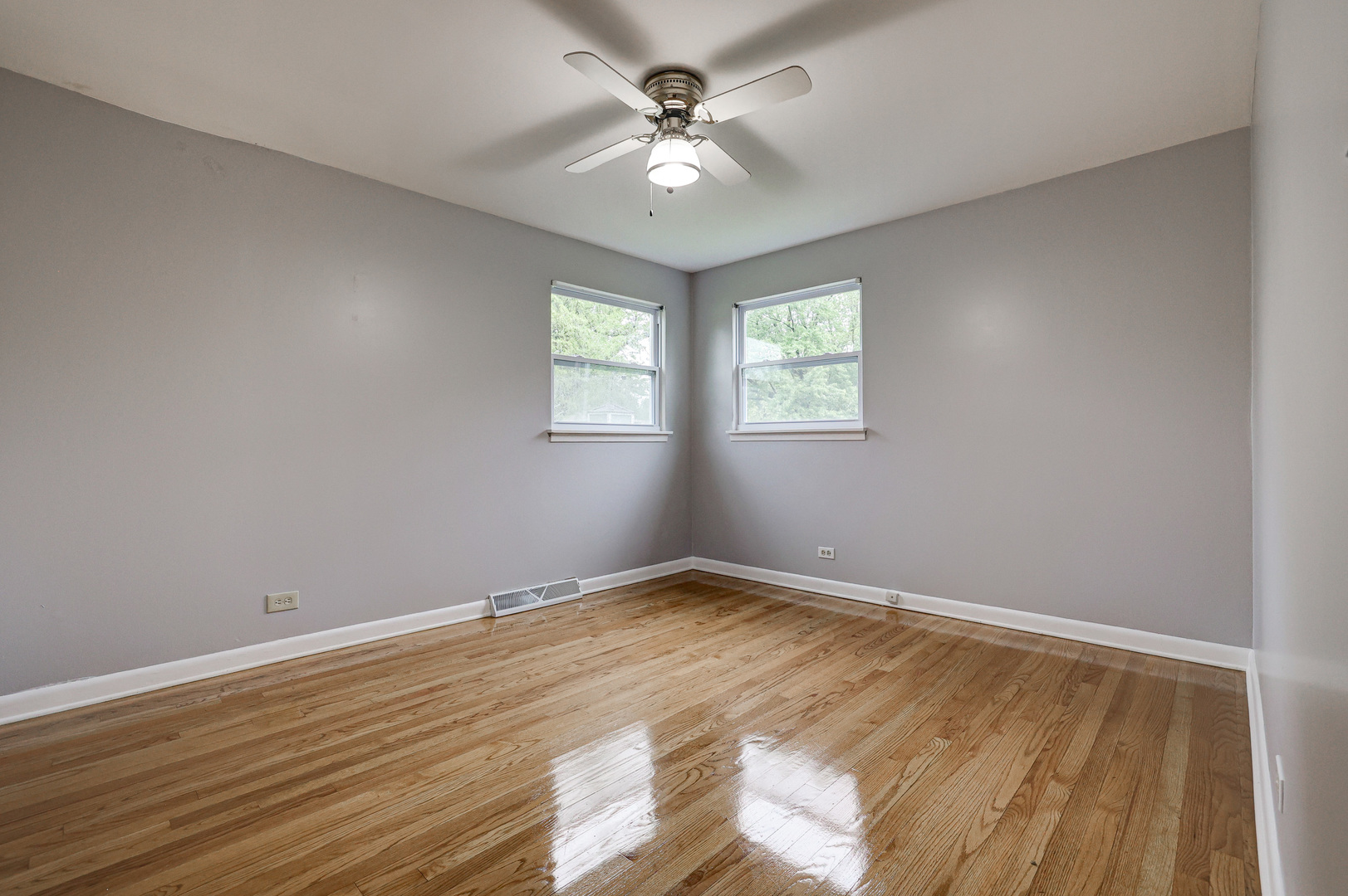 1401 Sunset Ridge Road Northbrook, IL 60062 - Photo 10 of 27 wooden floor in an empty room with a window