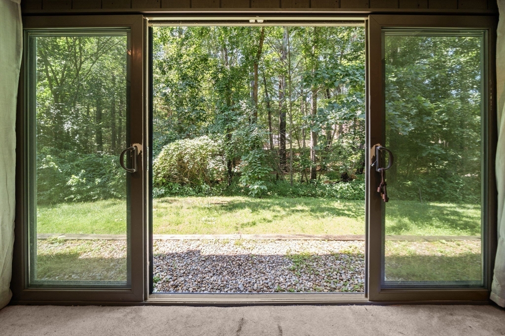 374 Great Road, Unit 11 Acton, MA 01720 - Photo 10 of 30 a view of a garden from a window
