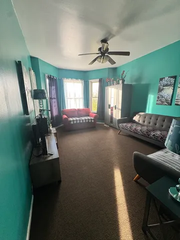 a room with furniture and a flat screen tv