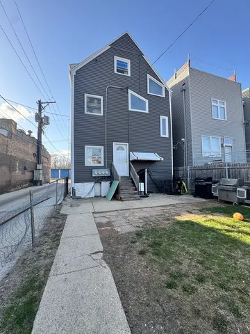 a view of a house with swimming pool and sitting area