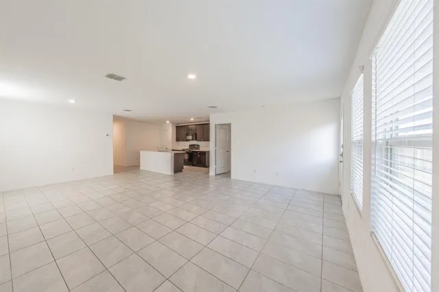 a view of a kitchen with furniture and a window