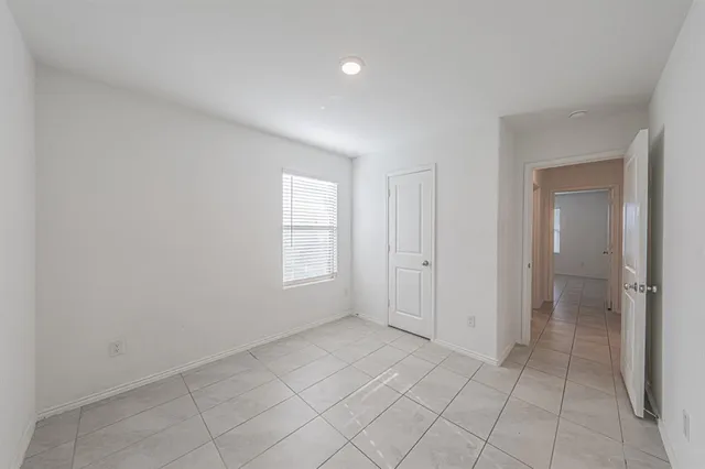 a view of an empty room and window