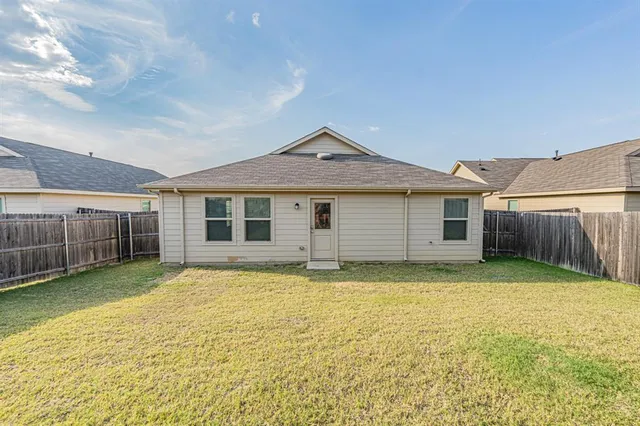 a front view of a house with yard