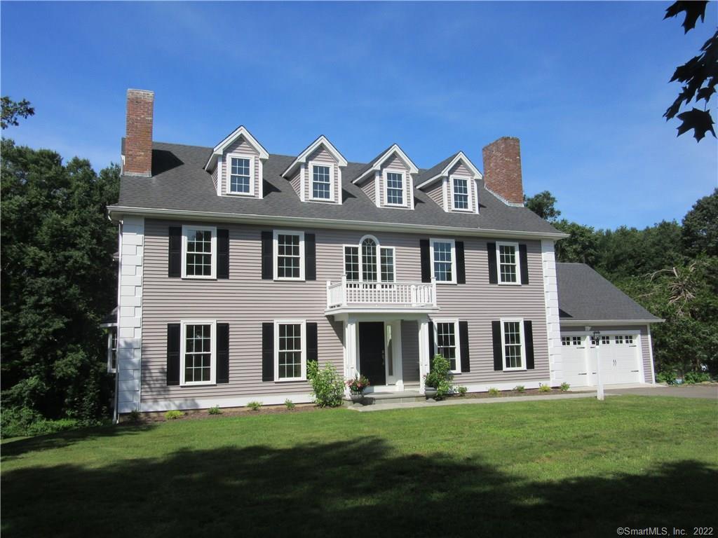 39 Randi Drive Madison, CT 06443 - Photo 1 of 1 a front view of a house with a garden