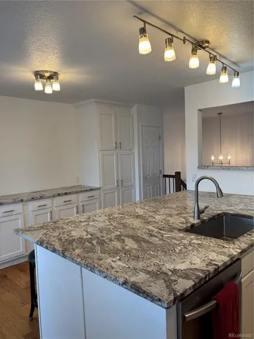 a kitchen with a sink and cabinets
