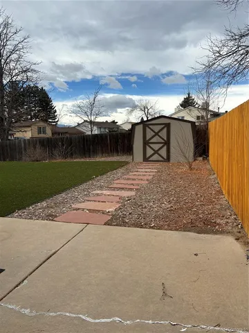 a view of a park with large trees