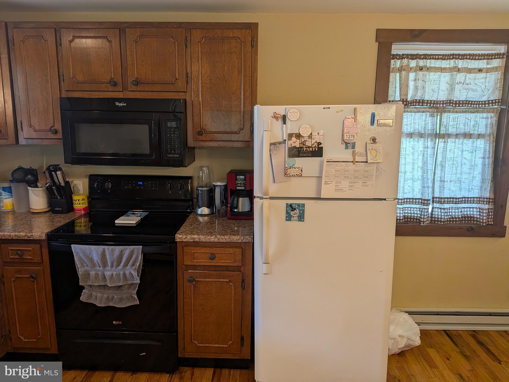2418 Muddy Run Road Mifflintown, PA 17059 - Photo 16 of 37 a kitchen with a refrigerator and a stove