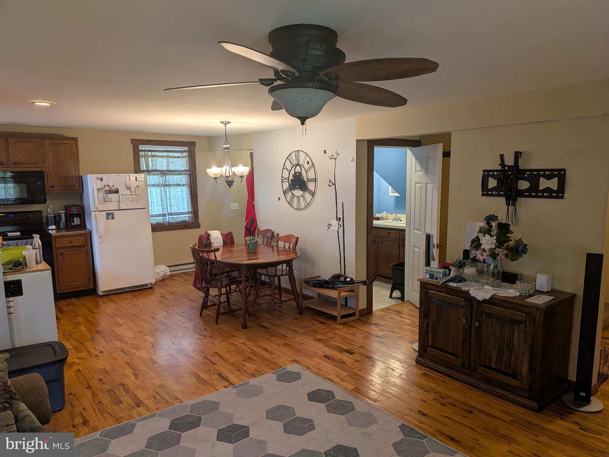 2418 Muddy Run Road Mifflintown, PA 17059 - Photo 24 of 37 a living room with furniture and wooden floor