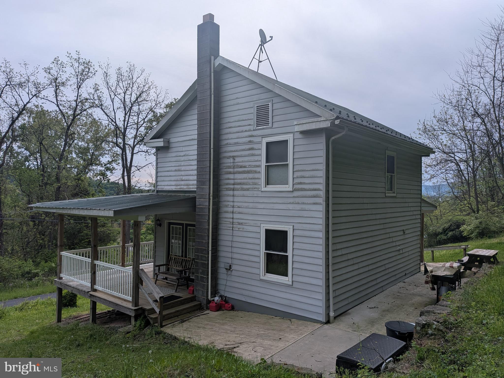 2418 Muddy Run Road Mifflintown, PA 17059 - Photo 4 of 37 a view of a small house with yard and furniture