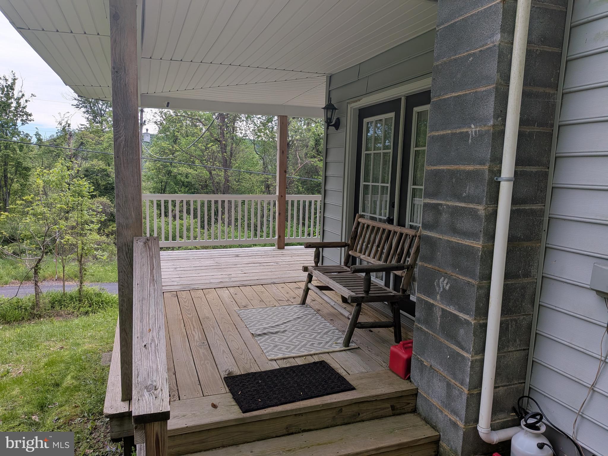 2418 Muddy Run Road Mifflintown, PA 17059 - Photo 9 of 37 a view of balcony with wooden floor and bench