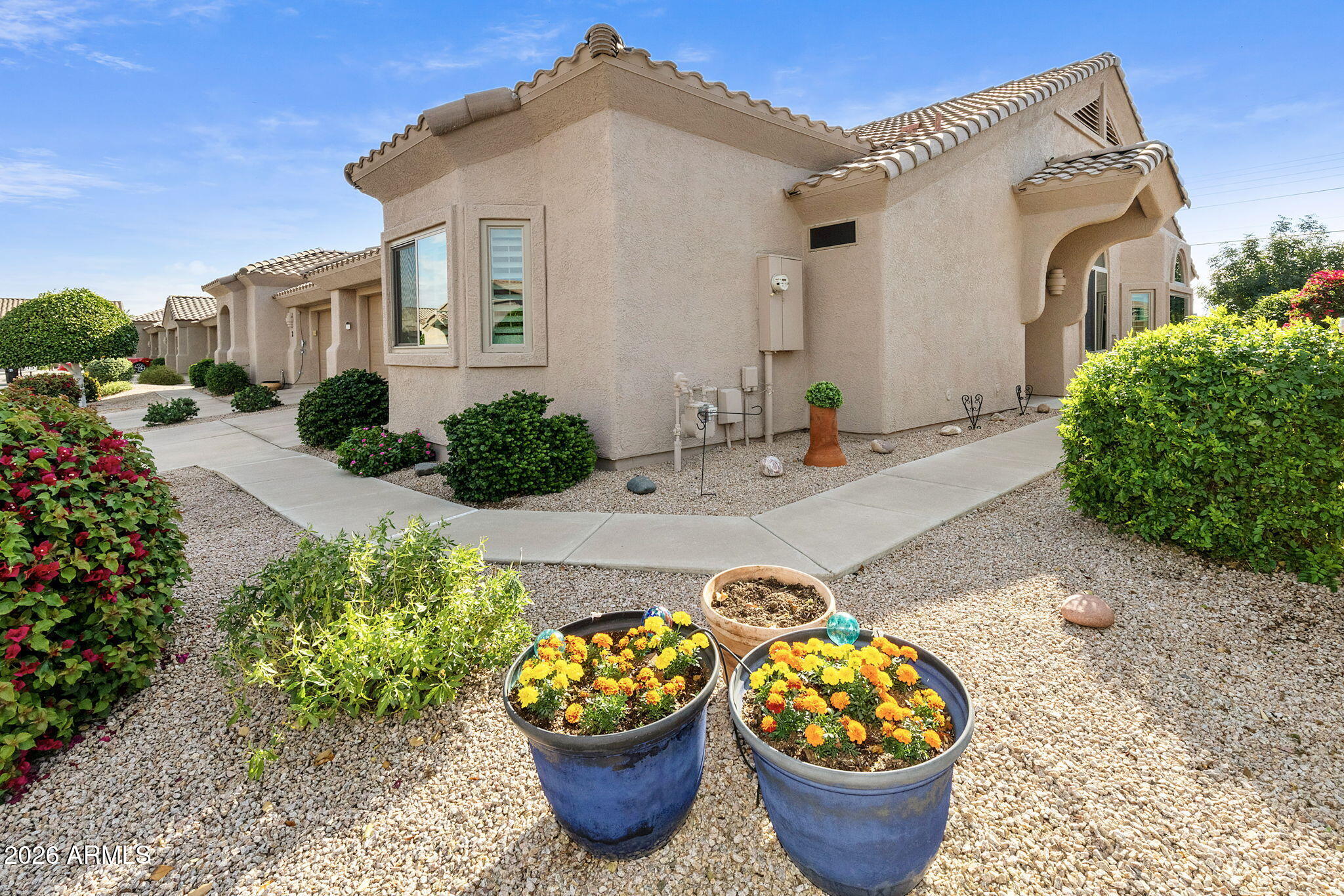 a front view of a house with garden