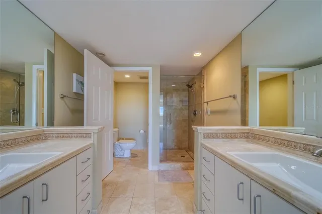 a spacious bedroom with a bed and a window