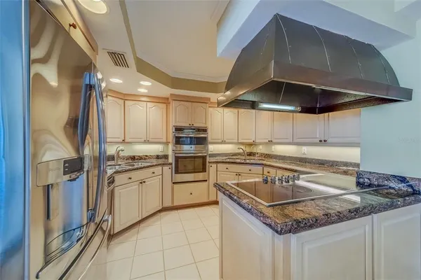 a kitchen with cabinets and window