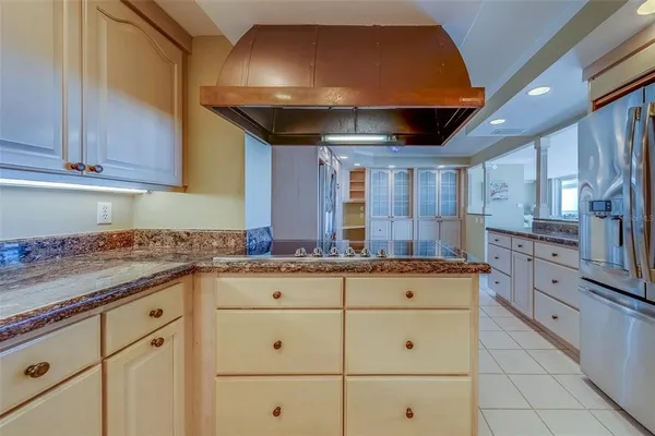 a view of a refrigerator in kitchen and wooden floor
