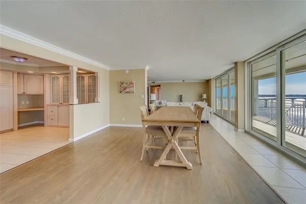 a spacious bedroom with a bed and large window