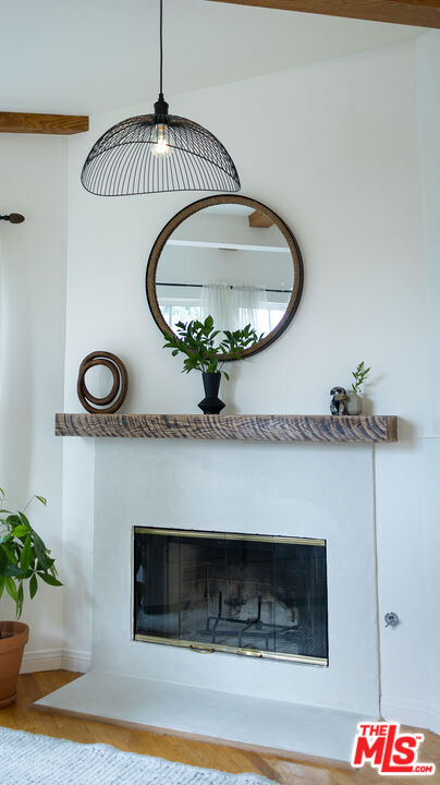 626 Oleander Drive Los Angeles, CA 90042 - Photo 13 of 75 a view of a livingroom with a fireplace and wooden floor